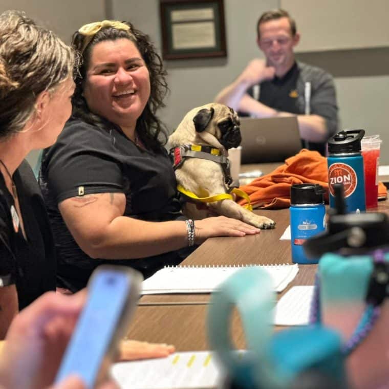 shelter staff with a pug