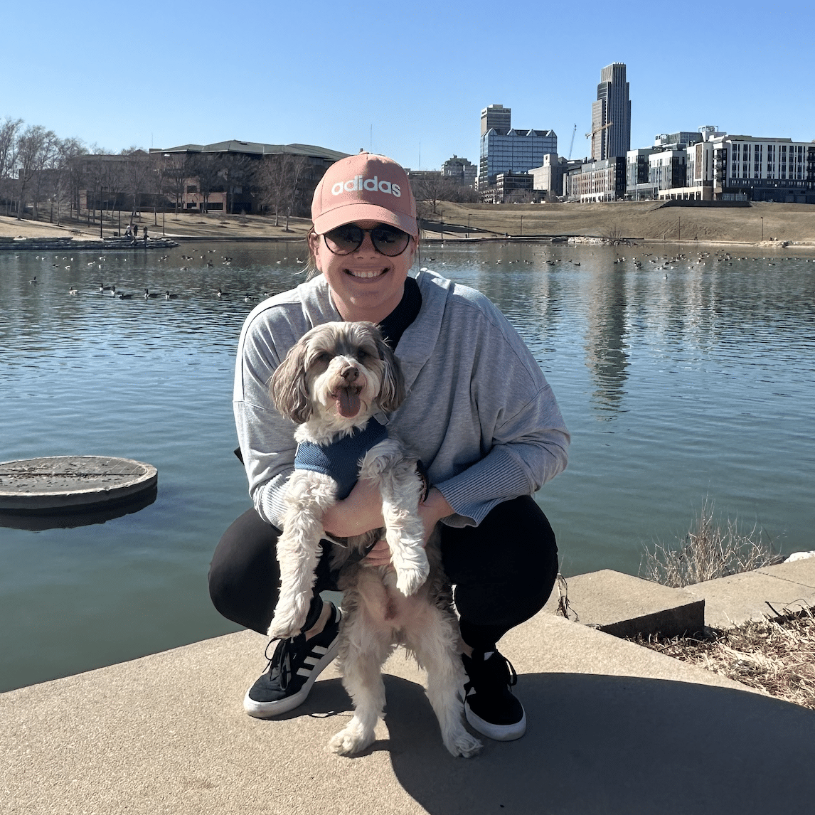Archie the dog with his owner near a body of water
