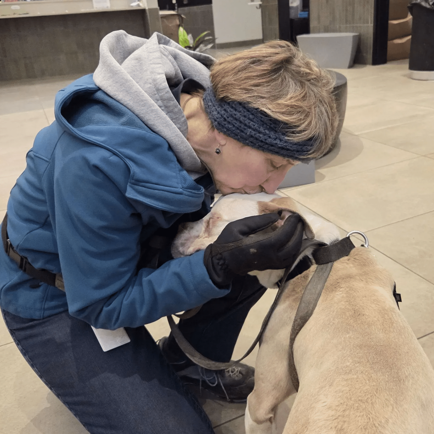 Mary the volunteer with a dog